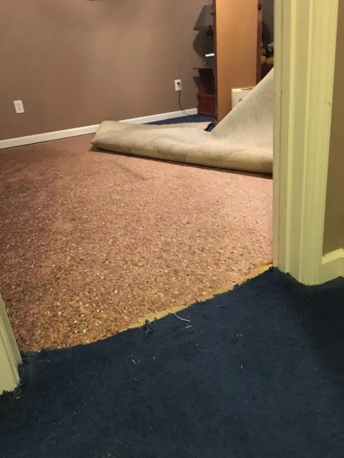 Carpet pad removal revealing water damage during Water Mitigation Services in Twin Falls